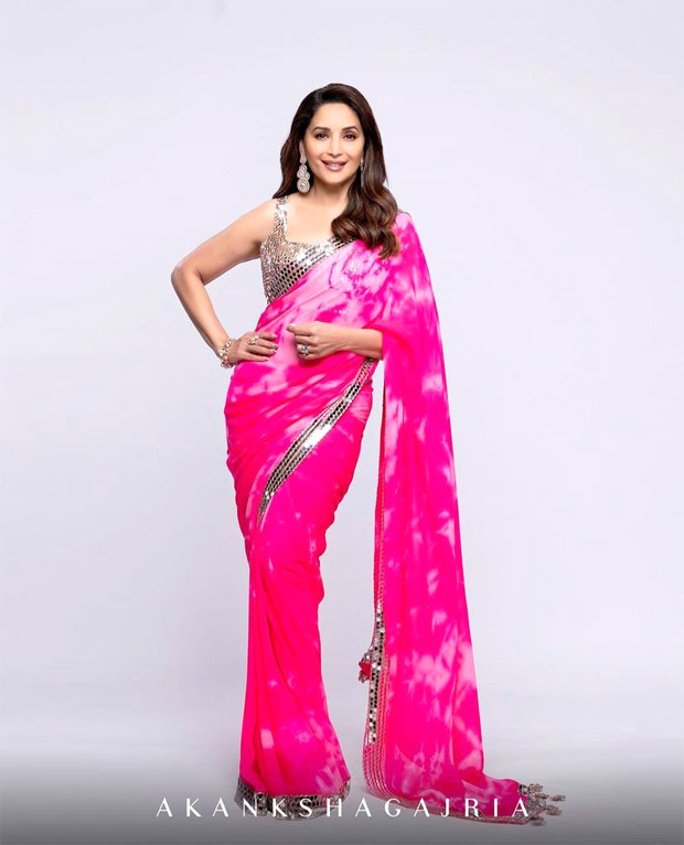 Madhuri-Dixit-is-an-absolute-beauty-in-a-bright-pink-tie-dye-saree-with-mirror-work-details-1.jpg