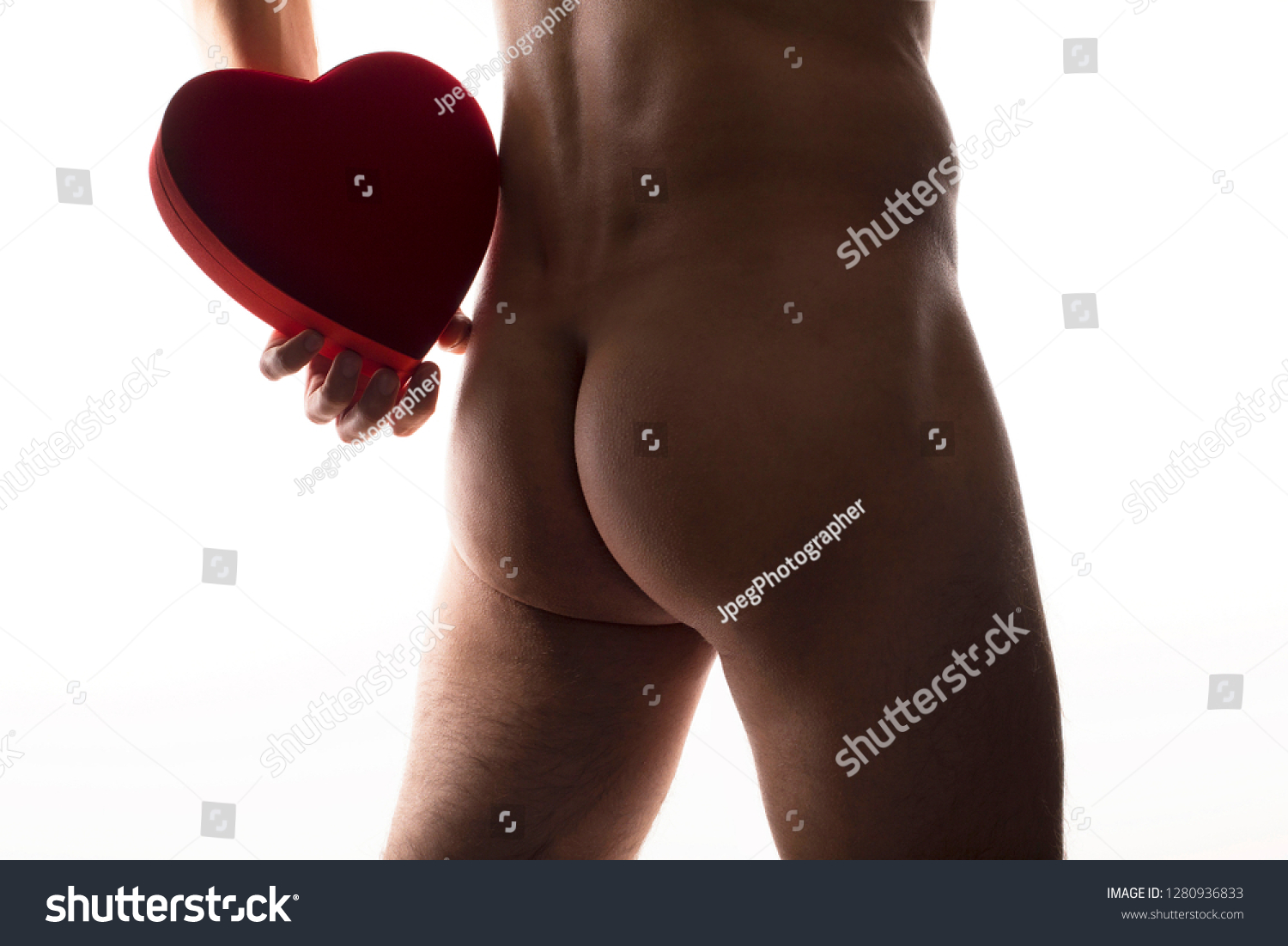 stock-photo-valentine-s-day-surprise-gift-naked-guy-with-heart-shaped-chocolate-box-behind-his-back-slim-fit-1280936833.jpg